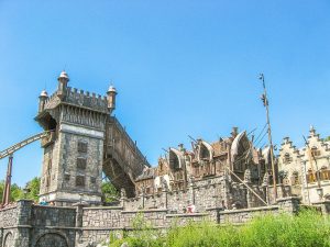 a stone and wooden structure with a tower, a roller-coaster in the Efteling