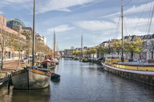 a canal in a city with boats on both sides; things to do in Leeuwarden