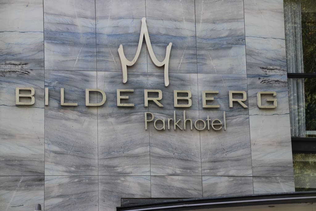 a sign on a building reading Bilderberg Parkhotel