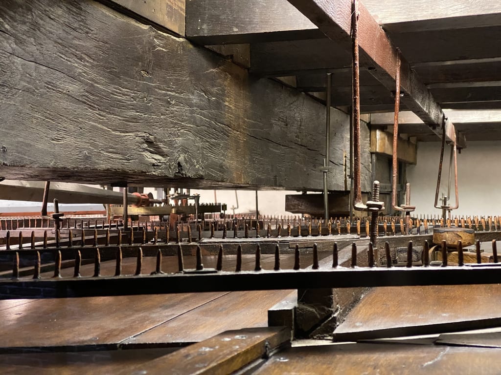 cogwheels and winches that function as a gear of large clock-work mechanism; The gear of the solar model in the planetarium in Franeker