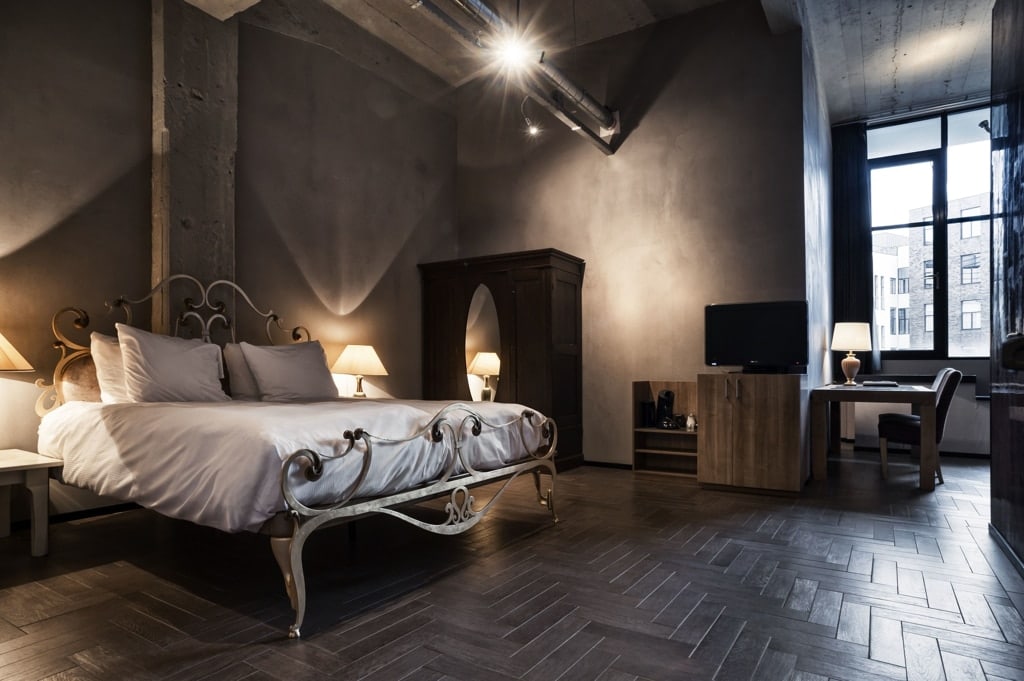 a luxurious hotel room in dark grey with a fancy bed in WestCord Hotel in Eindhoven